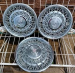 1975-1979 Cadillac Fleetwood Brougham 15" Wire Spoke Hubcap Wheel Covers (3) Used. Price: $175.00.